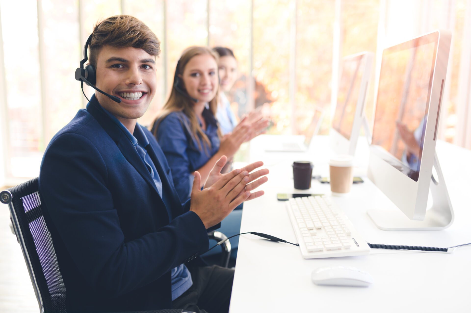 Call Center Service. Photo of customer support or sales agent.  Help line answering and telemarketing. Male caller or receptionist phone operator.Copy space for some text, advertising or slogan.